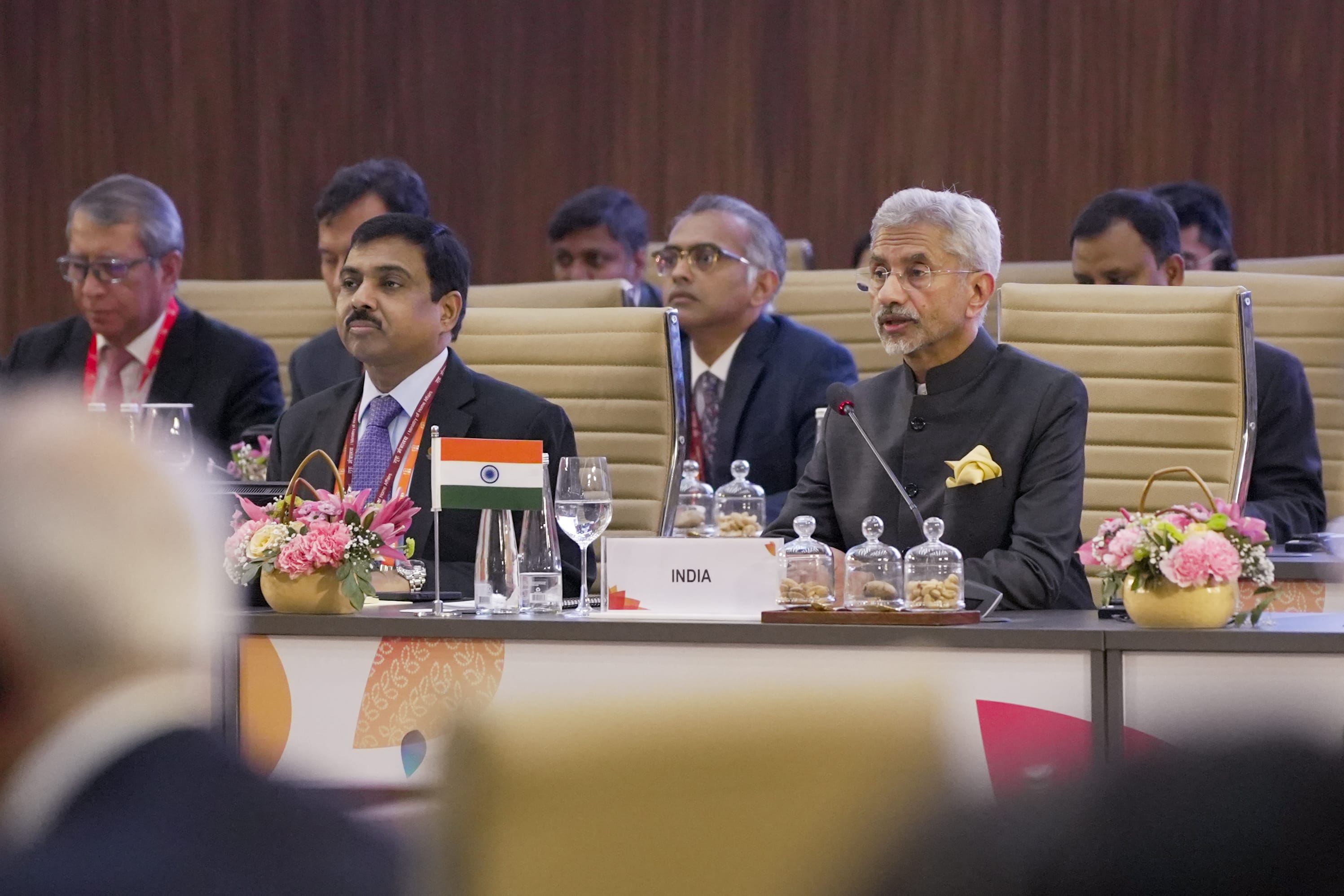 S. Jaishankar at a conference table, speaking. India flag and nameplate visible.